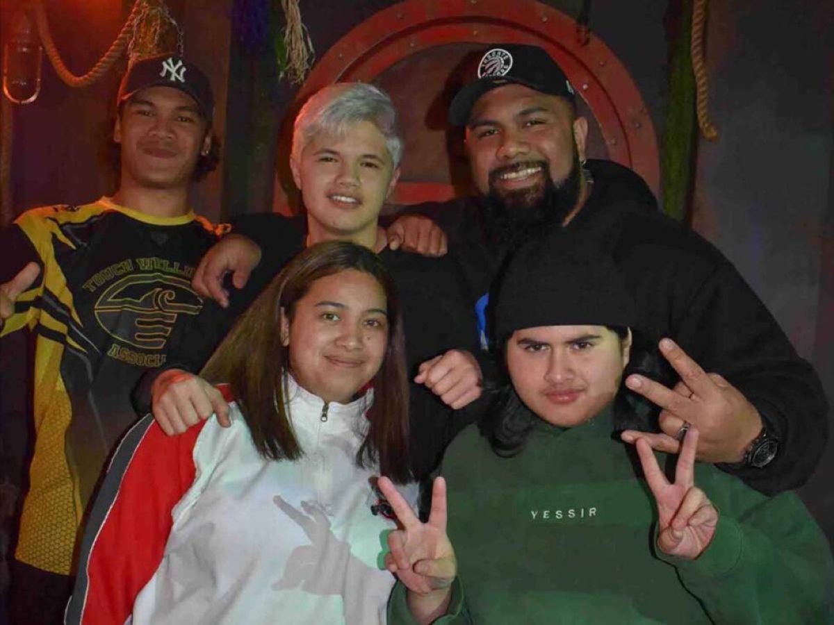 Julian Dennison et al. posing for a photo