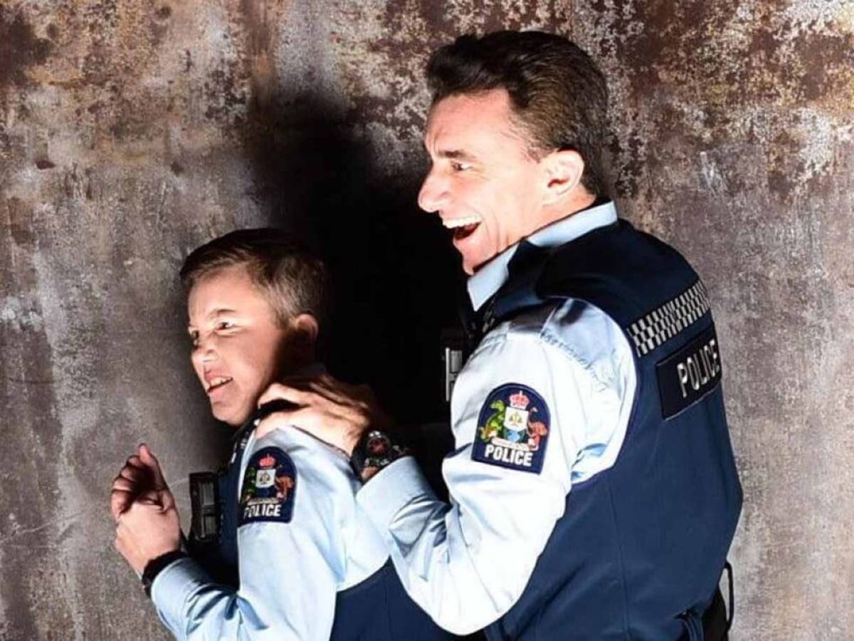 a man standing in front of a building