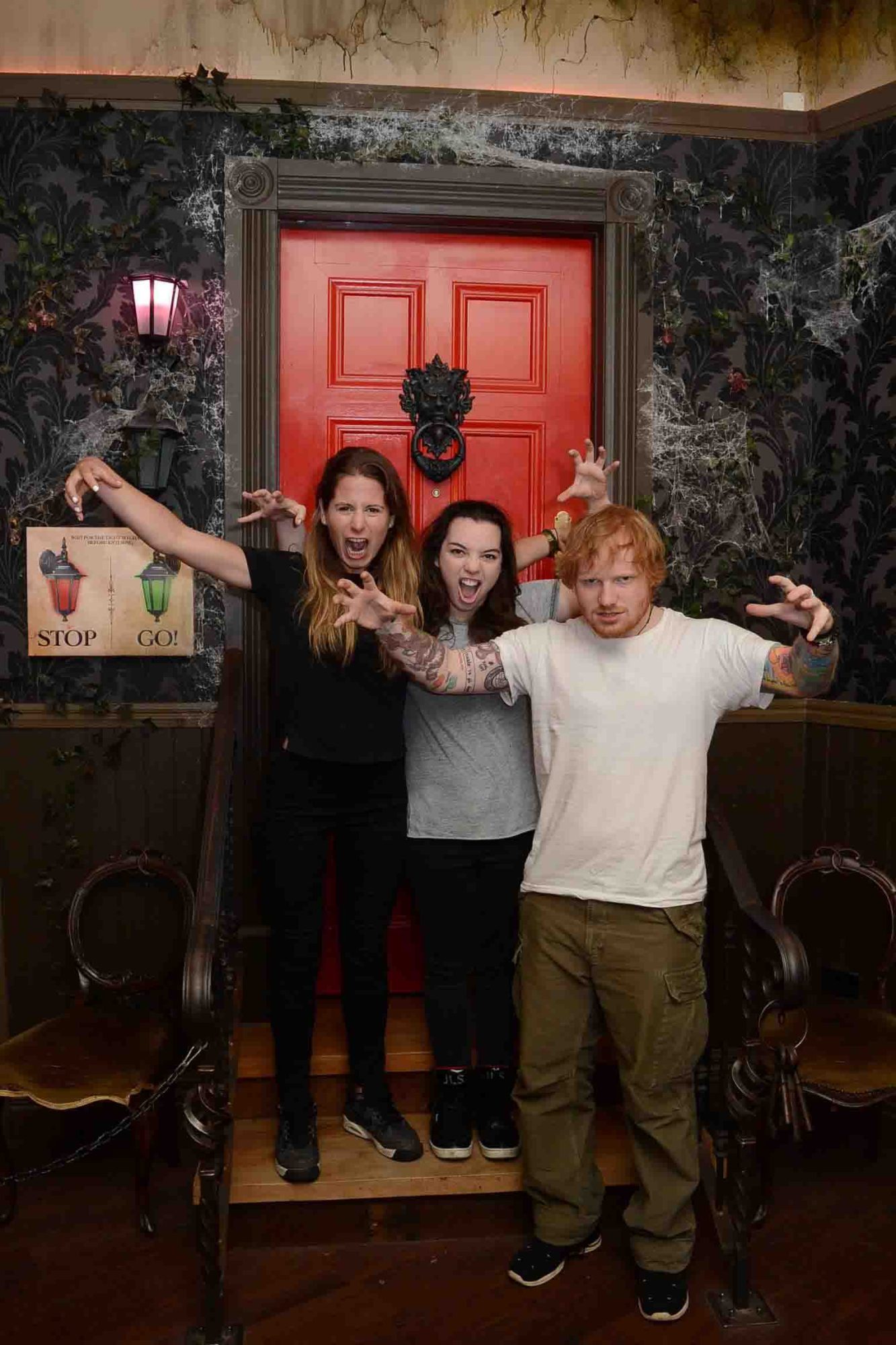 a man and a woman standing in front of a building