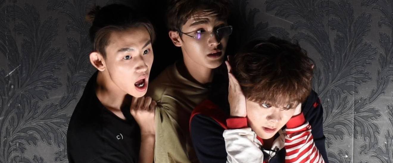 a young boy wearing a suit and tie