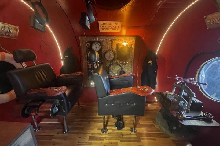 a room filled with furniture and a fireplace