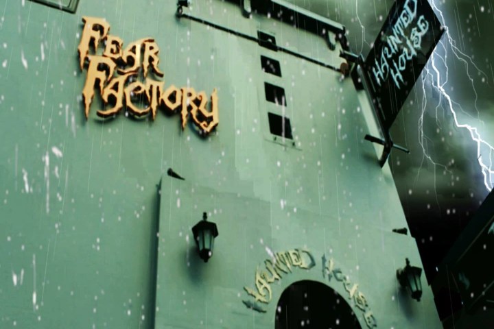 a clock hanging from the side of a building